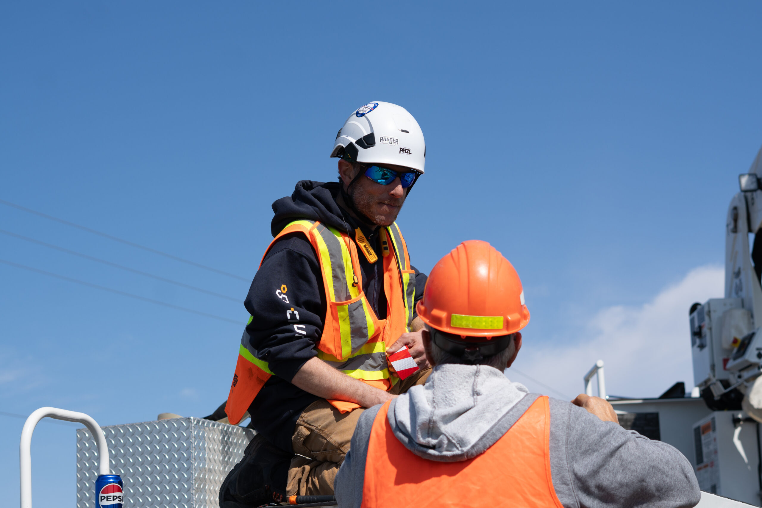 Technicians in targeted work on bucket unit